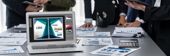 Graphic designer software for modern design of web page and commercial brisk ads showing on the computer screen