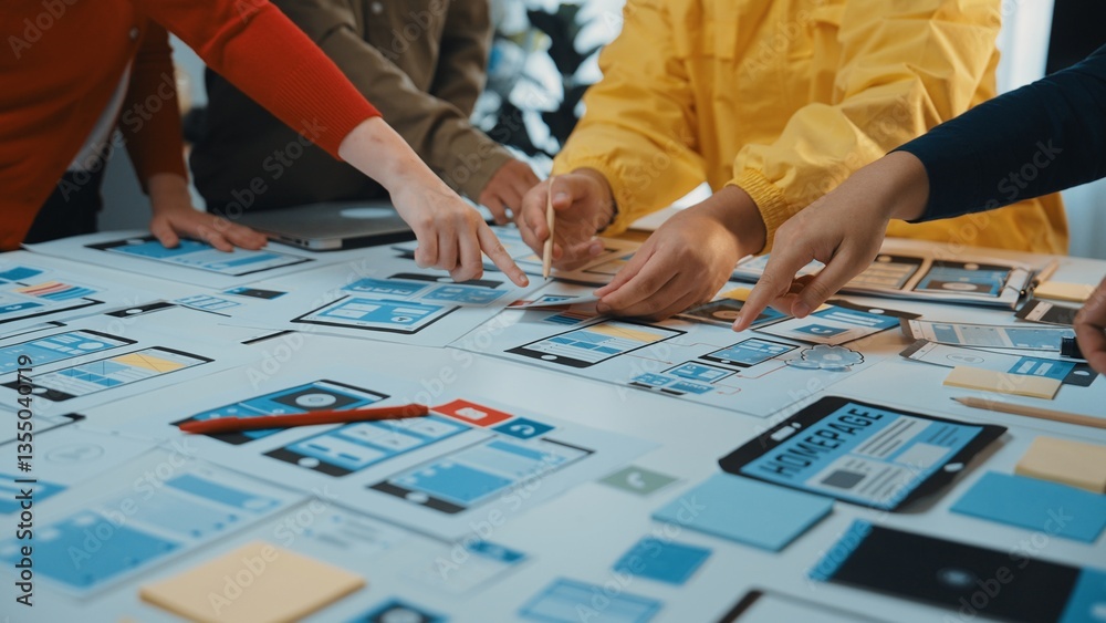 Poster a diverse team collaborates during a design session, creating wireframes and prototypes on a large t