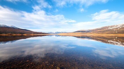 Serene landscape view of a calm lake surrounded by mountains and blue sky reflections : Generative AI