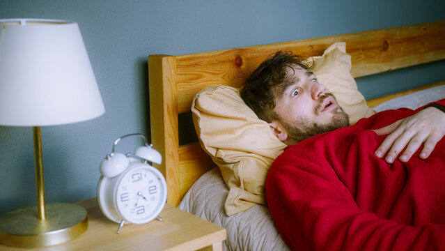 Man Waking Up in Shock After a Nightmare &ndash; Sleep Paralysis or Sleep Apnea Reaction