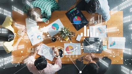 Top view of business people working and analyzing investment data with financial chart and stock...