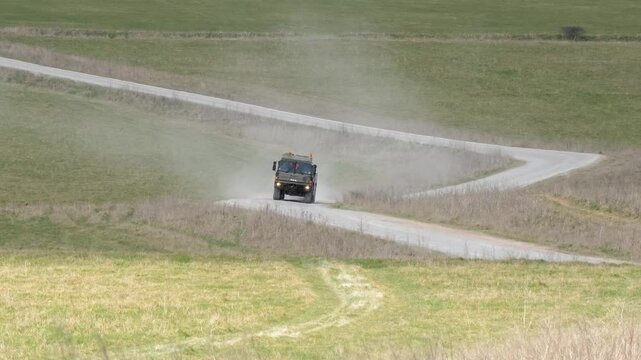 a British army MAN SVR (Support Vehicle Recovery) 8x8 Truck in action on a dusty track