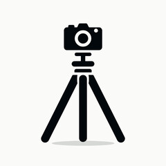 very simple flat and minimalist Camera Tripod silhouette in black on a white background