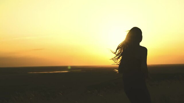 sunset run with a girl in motion, energetic run as the daylight fades, silhouette of a girl jogging in the evening light, vibrant sunset with a girl dashing forward, one step at a time, girl in motion