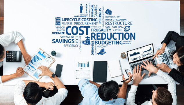 A diverse business team works together on cost reduction strategies, utilizing modern technology and data analysis to enhance budgeting and improve financial efficiency in the office. Amity