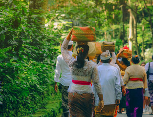 Selective focus on basket on the woman head during the celebration in Ubud, Bali, Indonesia