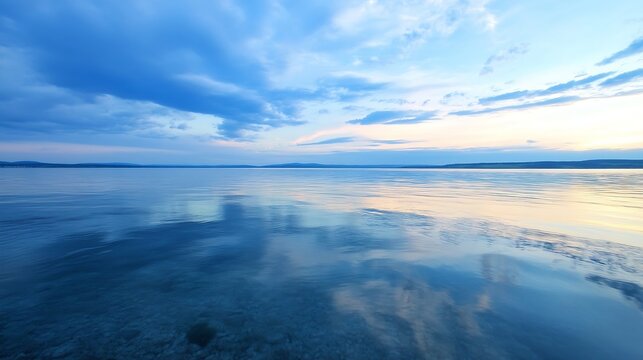Stunning landscape of calm water reflecting clouds at twilight creating a tranquil atmosphere : Generative AI