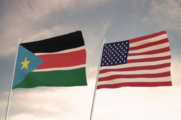 Relations between the countries of the United States of America USA and SOUTH SUDAN represented by the concept of two flags waving against a cloudy sky.3d render.