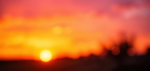 Soft-focus sunset, blurred orange and purple hues, wonder, celestial, peaceful