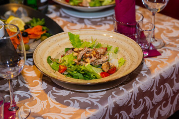 Variety of fresh food on the table. plate of meat salad