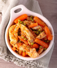 Chicken breast with carrot and peas