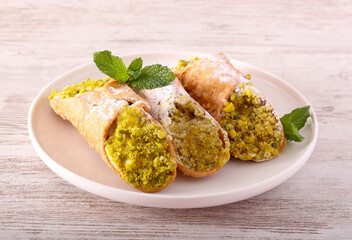 Cannoli with ricotta and pistachio