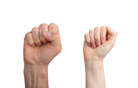 Clenched fist raised in victory, symbolizing strength and power. Male and female adults showing a