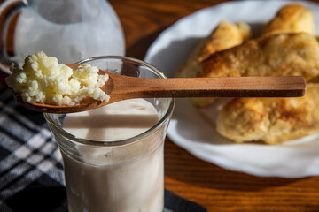 Homemade kefir fermented product of milk, kefir in the spoon.