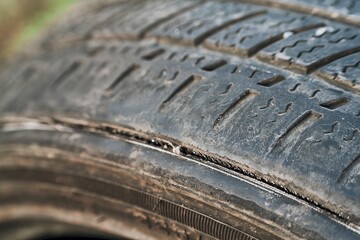 Old car tire with surface wear and tear