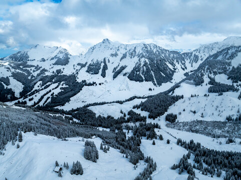 Aerial view of snow covered mountain landscape in Swiss alps. - Powered by Adobe