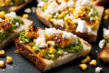 Grilled corn and avocado sourdough toast with soft goats cheese