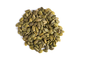 Pumpkin seeds isolated on white background. Closeup.