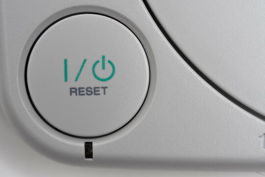 Closeup of the power button on the game console.