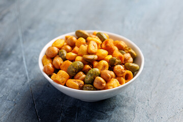 Sweet chilli Crunch protein packed mix of baked corn pieces, edamame beans, chickpeas and corn hoops. Healthy snack concept