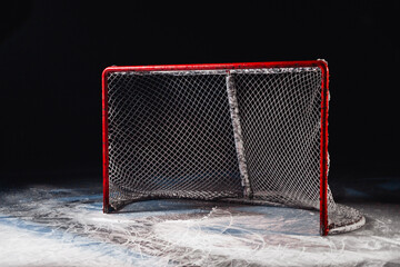 Hockey goal on ice on black background - hockey arena © andrey gonchar