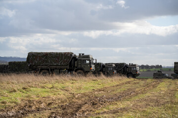several British army MAN SV 4x4 utility truck on a military exercise