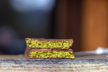 Luxury trending Dubai chocolate with creamy pistachio filling and crispy kataifi dough. Middle Eastern sweets
