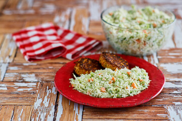 creamy coleslaw with shredded carrot and green onion