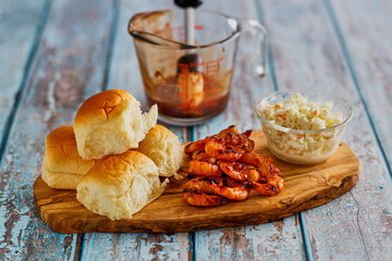shrimp sliders with coleslaw and an Asian style BBQ sauce