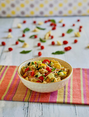 Greek tortellini salad with cucumber, bell pepper, and cherry tomatoes