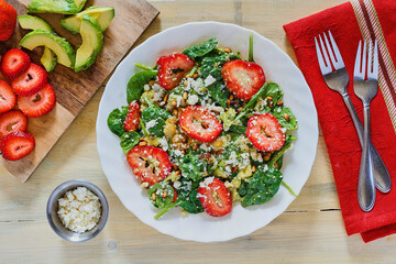 strawberry spinach salad topped with goat cheese