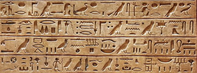 Old Egyptian hieroglyphs on an ancient background. Wide historical and culture background. Ancient...