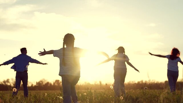 happy family running through field sunset, family child kid mother father running dream, Children Playing Field Sunset, Joyful Kid Outstretched Arms, Family Fun Nature, Carefree Childhood Moments
