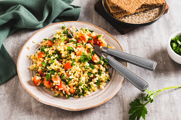 Traditional vegetarian tabbouleh salad on a plate on the table