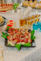 A beautifully decorated table with snacks oA beautifully decorated table with snacks on it with snacks and cakes for the holiday. In the foregroundn it with snacks and cakes for the holiday