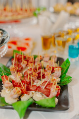 A beautifully decorated table with snacks on it with snacks and cakes for the holiday. The snacks in the foreground are large