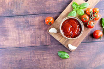 Tomato paste, sauce, ketchup and cherry tomatoes on branches and basil