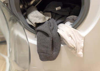 things in the washing machine. white and gray colors