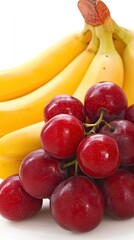 Ripe bananas and plums on white background; healthy food concept