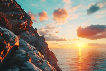 A serene sunset over the ocean, framed by rocky cliffs and colorful clouds.