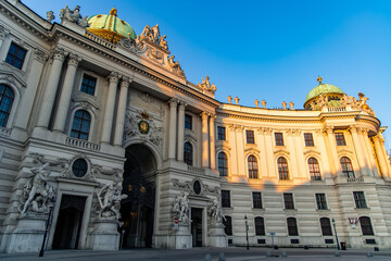 Michaelertrakt entrance of Hofburg Palace shining in morning sunlight, Vienna, Austria