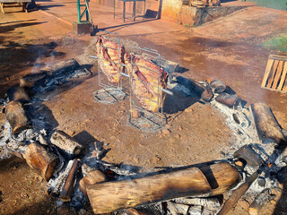 Beef rib barbecue being roasted using the ground fire technique in southern Brazil