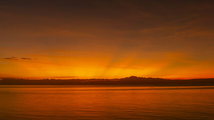 Stunning sunset over calm ocean waters