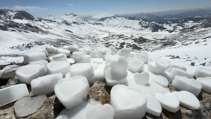 winter texture of mountains, heart shapes made of snow, longing for mountains, affection and love