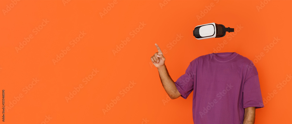 Leinwandbilder User explores virtual reality using modern goggles, gesturing as if interacting with digital elements. The vibrant orange background highlights the cutting-edge tech experience.