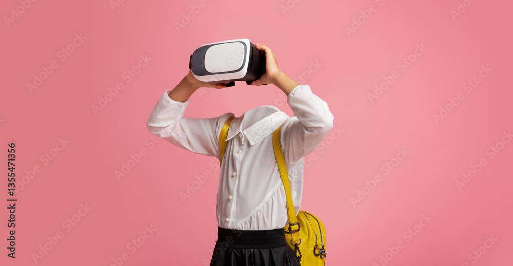 Poster a schoolgirl engages with virtual reality technology using goggles, standing against a bright pink b