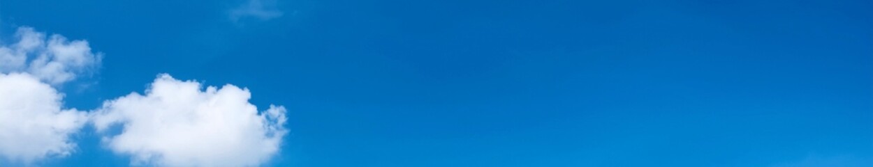Clear Blue Sky with Light Clouds and Peaceful Summer Atmosphere