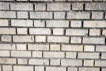 Detailed texture of a weathered white brick wall, perfect for adding depth and character background for textures