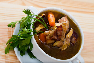 Image of tasty scottish traditional soup cock-a-leekie with chicken, bacon and leek