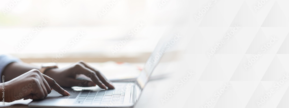 Poster Closeup of unrecognizable black woman working on laptop, typing on computer keyboard while working in office, side view, cropped image